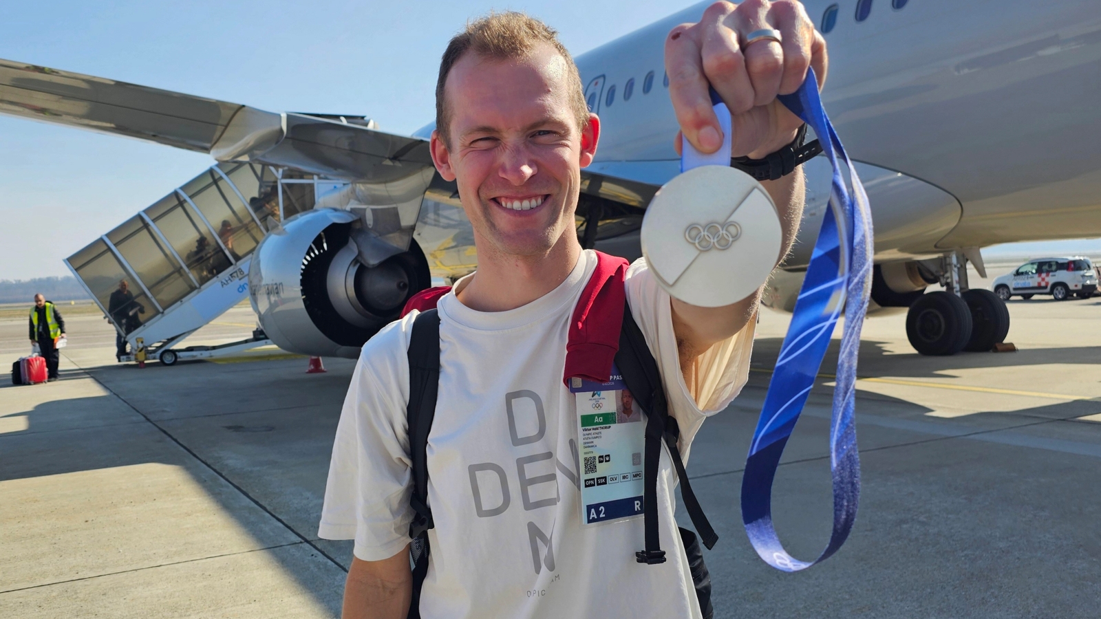 Olympic speed skater Viktor Thorup holding his silver medal after the Milano-Cortina 2026 Winter Olympics